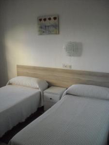 弗洛尔布兰科旅舍客房内的一张或多张床位