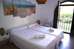 Casa VALOLI PLAYA MIRAMAR客房内的一张或多张床位
