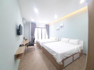 MIDMOST C22 Apartment客房内的一张或多张床位