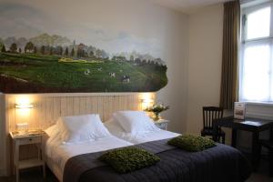 赫伯格布拉邦特克鲁斯酒店客房内的一张或多张床位