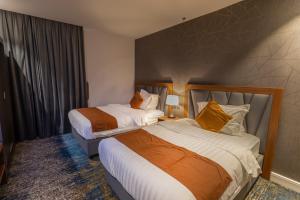 دانة المروج للأجنحة الفندقية Danat Almourouj Hotel Suites客房内的一张或多张床位