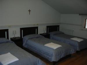 Casa per Ferie Suore Domenicane客房内的一张或多张床位