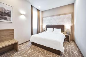 Radisson Hotel City Centre Odesa客房内的一张或多张床位