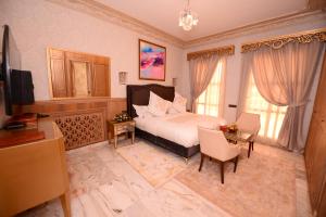 THE WHITE PALACE Rabat客房内的一张或多张床位