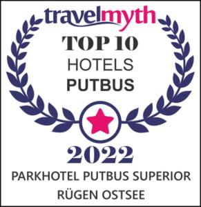 普特布斯Parkhotel Putbus Superior International的匹兹堡州顶部的标志