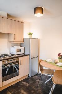 Snapos Apartments - Tudor Close的厨房或小厨房