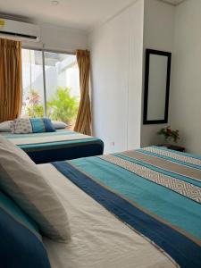 Apartamentos Playa Rodadero客房内的一张或多张床位