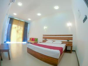 Hotel Anaulundawa客房内的一张或多张床位