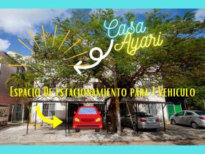 坎昆Casa Ayari - 3 Habitaciones - 2 a 6 personas - WIFI- AC的红色汽车停车场的标志