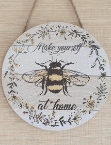 蒙特罗斯A-Wave From It All的一只蜜蜂在上面的盘子,上面写着字,使自己在家中