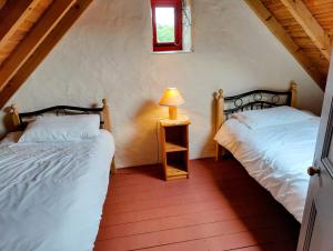 Carraun Cottage客房内的一张或多张床位