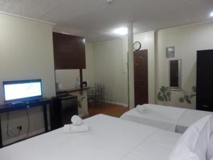 Casa Saudade Condotels and Transient Rooms客房内的一张或多张床位