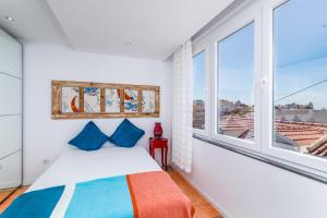 T2 Tiles Apartment Estoril客房内的一张或多张床位