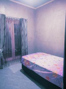 COCIZ homestay by Rumah Tourist客房内的一张或多张床位