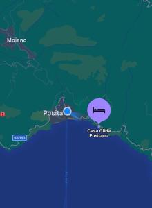 波西塔诺Casa Gilda Positano的显示印花花花和波图加尔海岸俱乐部位置的地图