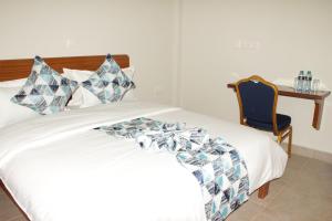 Sai Inn Eldoret客房内的一张或多张床位