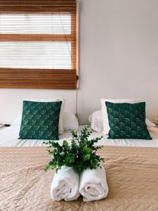 Casa di Caribe - palmtree客房内的一张或多张床位