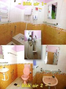 Kampong TamanSeri Idaman Guest House (Pasir Mas)的一间带水槽、卫生间和镜子的浴室