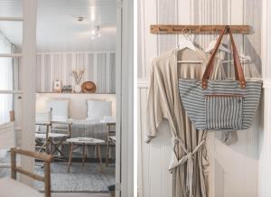 摩尔比兰加Eco by StrandNära的客房设有带椅子和桌子的衣柜。
