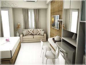 泗水Cosmy Tanglin Apartment的客厅配有床和沙发