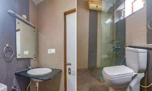 海得拉巴FabHotel Pride Inn Financia的浴室配有卫生间、盥洗盆和淋浴。