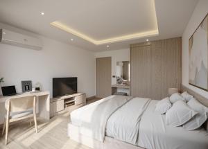 曼谷Leon Lasalle Hotel and Residences的白色卧室设有一张大床和电视。