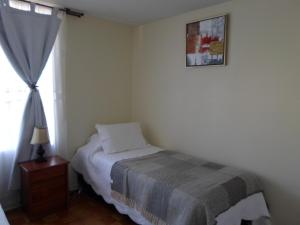 格雷西亚大道爱蒙布拉多公寓客房内的一张或多张床位