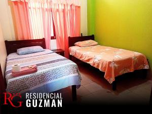 Residencial Guzmán 1客房内的一张或多张床位