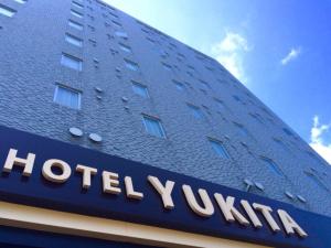 札幌Hotel Yukita - Vacation STAY 20929v的建筑一侧的酒店标志