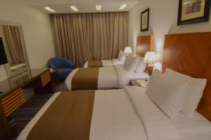 Al Massa Grand Hotel客房内的一张或多张床位