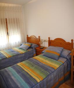 夸特洛埃斯奎因纳斯旅馆客房内的一张或多张床位