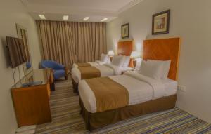 Al Massa Grand Hotel客房内的一张或多张床位