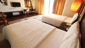 科隆戈特威套房酒店客房内的一张或多张床位