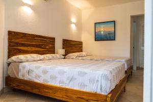赛姆Hermoso Departamento Casa Blanca remodelado 2 Habitaciones Wi-Fi Netflix的双床间设有2张单人床。
