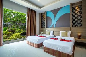 Areeka Resort Phuket客房内的一张或多张床位