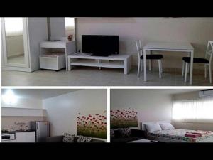 Thung Si KanThailand Taxi Apartment Hostel的客厅和带电视的客厅的两张照片