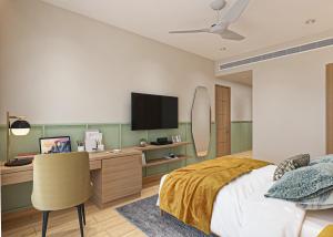 孟买巴瓦瑞跟酒店的一间卧室配有一张床和一张书桌及电视