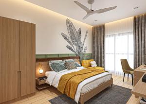 孟买巴瓦瑞跟酒店的一间卧室配有一张床和一张书桌