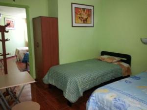 Hostal Puerto Ingles客房内的一张或多张床位