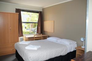 尼考公寓酒店客房内的一张或多张床位