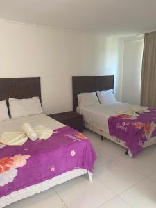 Beach Class Muro Alto Condomínio Resort - New Time客房内的一张或多张床位