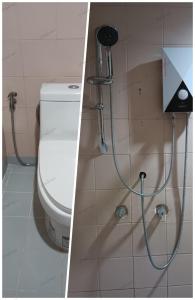 纳仲天Ban Nam Mao Resort的一间带卫生间和淋浴头的浴室
