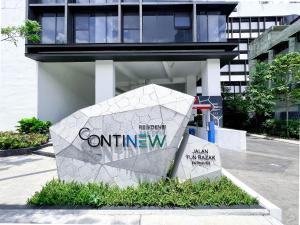 吉隆坡Continew Residences TRX Lux Pool View的建筑物入口的标志