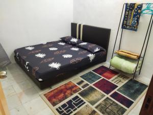 Homesstay De' Restu客房内的一张或多张床位