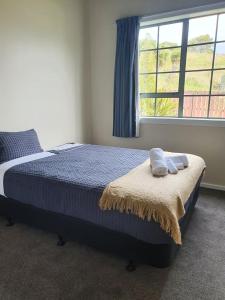 Ludstone Villa - A charming family home客房内的一张或多张床位