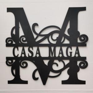 马斯帕洛马斯Casa Maga的黑色的标志,说la casa魔术