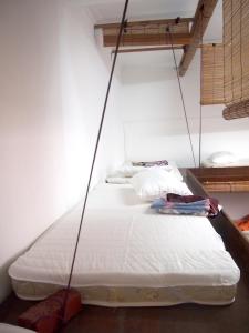 SS2普罗杰宇智旅舍客房内的一张或多张床位