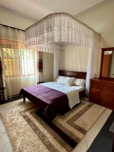 Makanga Hill Suites客房内的一张或多张床位
