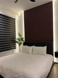 Ardel Suite homestay @ troika kota bharu客房内的一张或多张床位