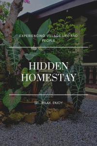 马兰Hidden Homestay的植物前隐匿的家园的标志